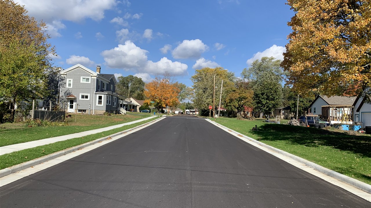 Urbanized Clayton Avenue with new curb, gutter, and sidewalk in East Troy