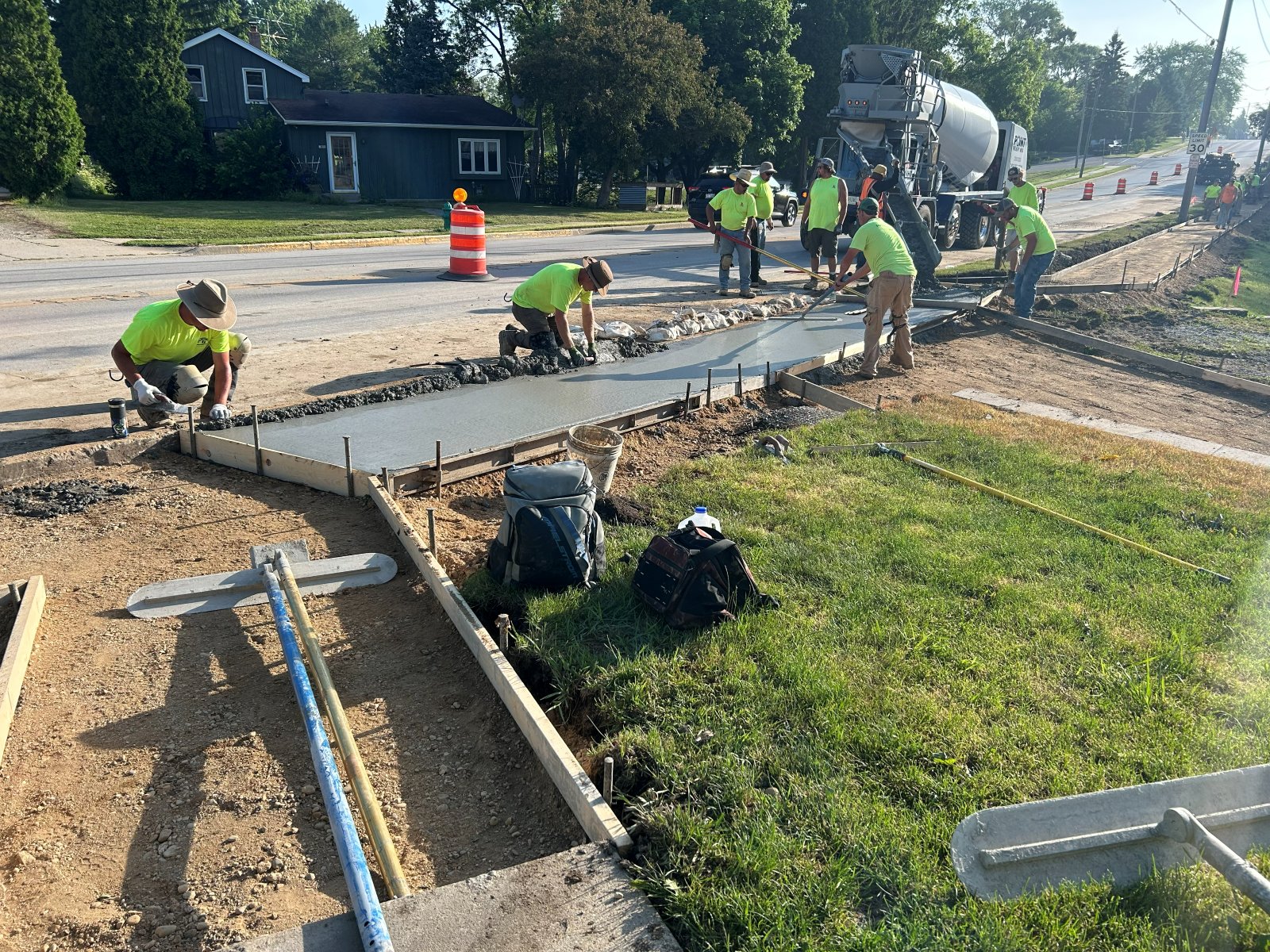Crew placing and finishing concrete for the new Main Street sidewalk in East Troy