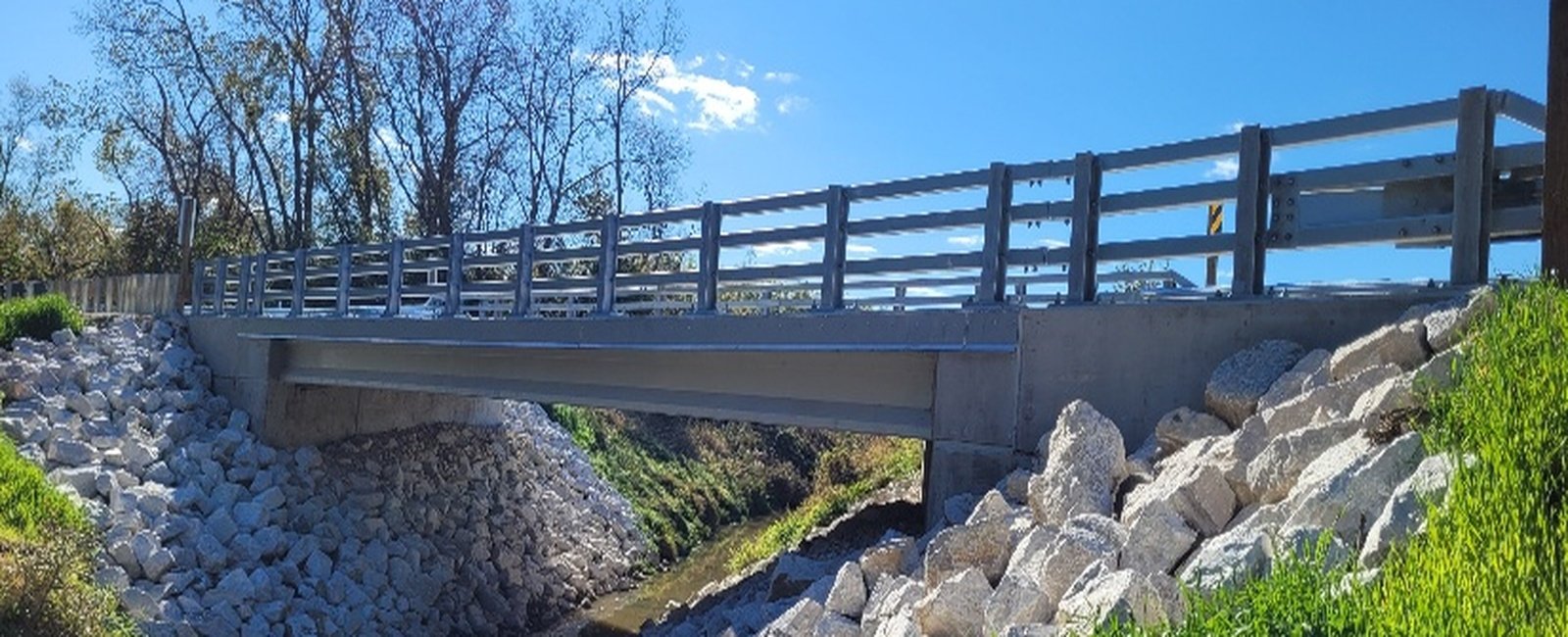 Completed Mt. Tom Road bridge over Hoosier Creek Canal with riprap slopes