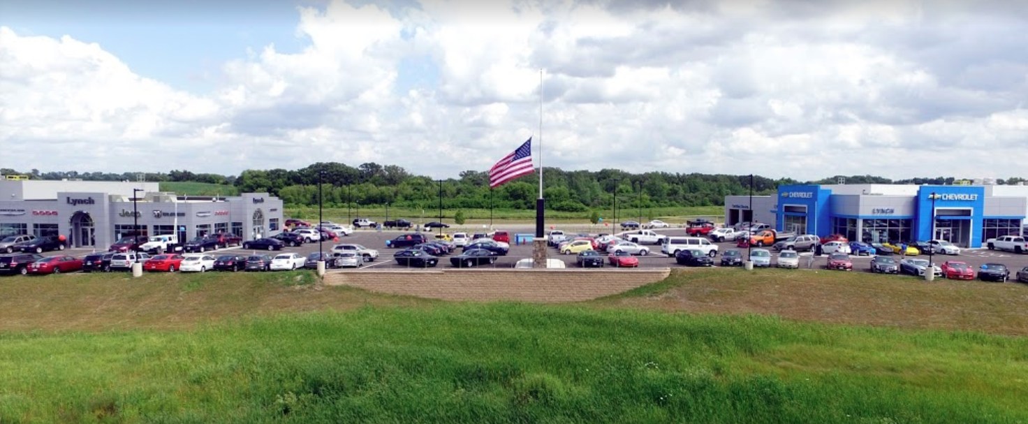 The completed Lynch Mukwonago campus: Chrysler/Jeep and Chevrolet dealerships flanking the flag plaza