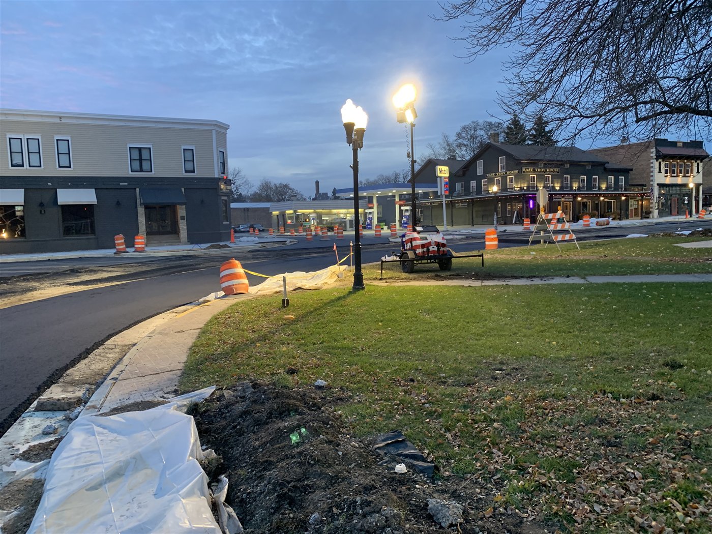 Evening view of the Village Square green and storefronts during reconstruction