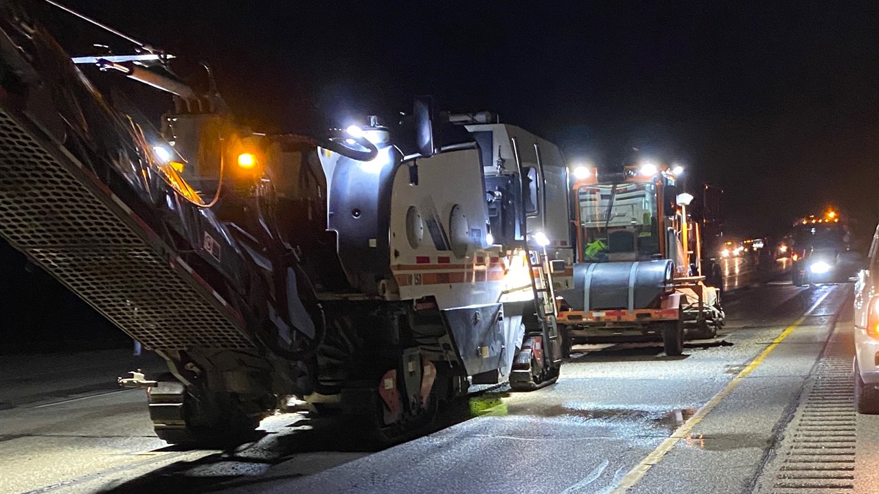 Milling train working under lights during a night closure on IH-94